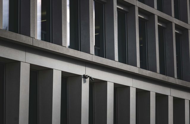 Modern corporate building protected by security services